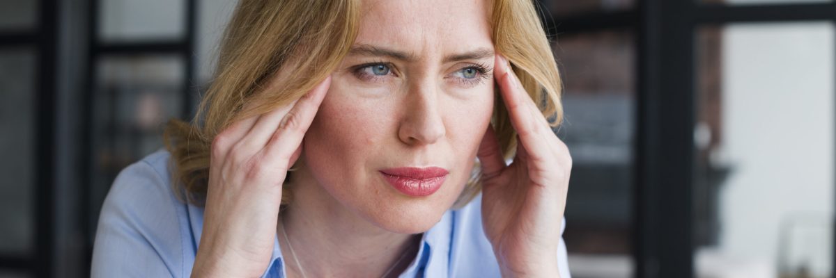 stressed-business-woman-holding-head